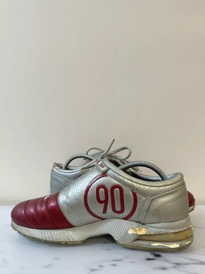 6973816