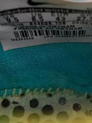 6973779