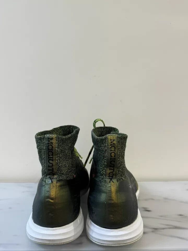 6973771