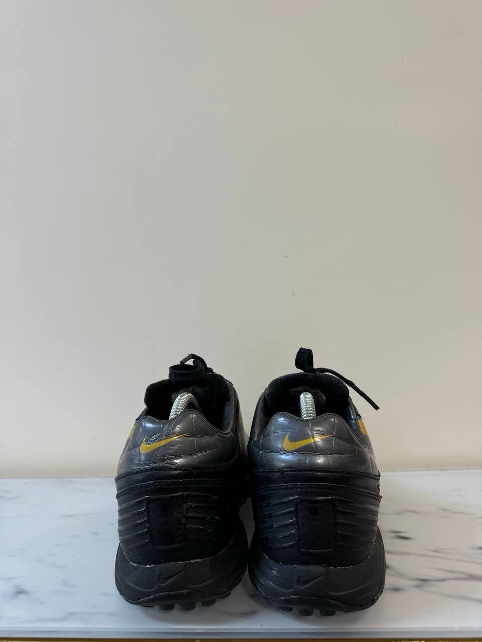 7698356