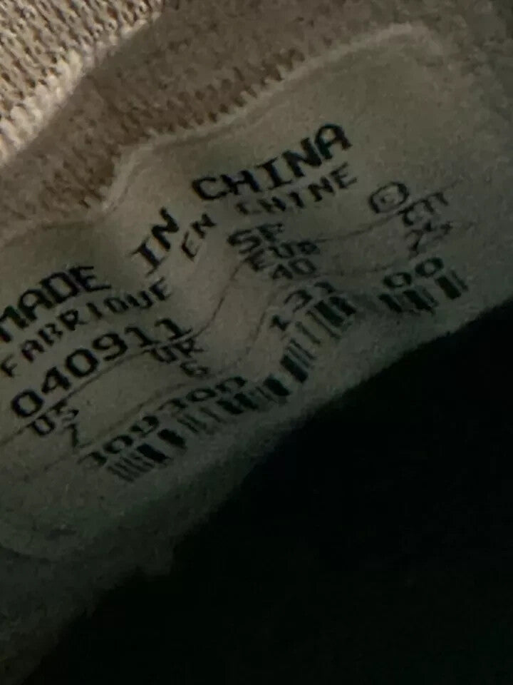 6973879