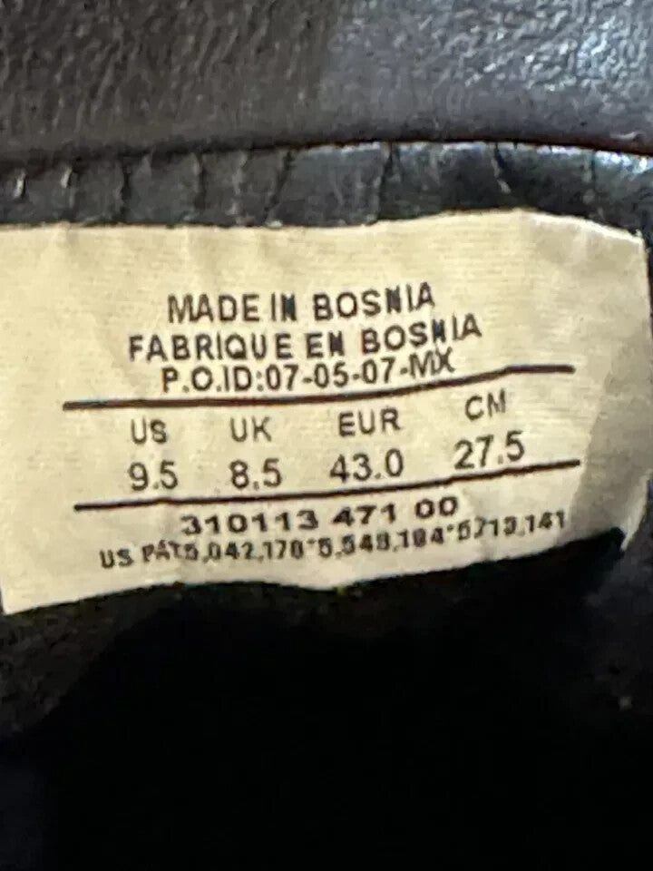 6973853