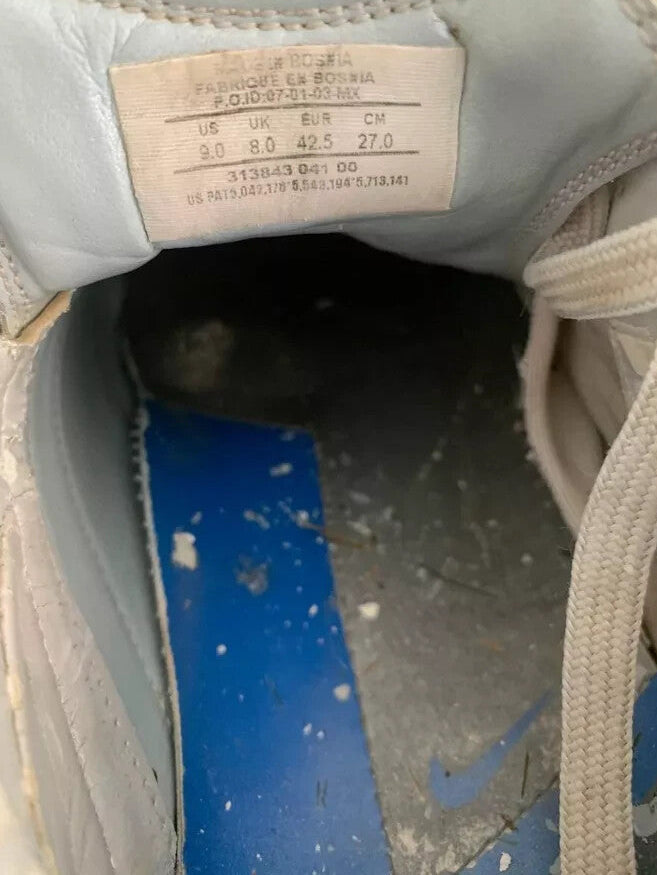 6973787