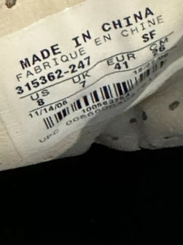 6973855