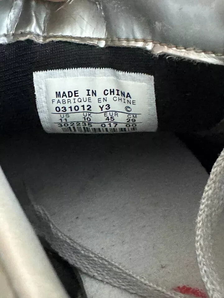 6973870