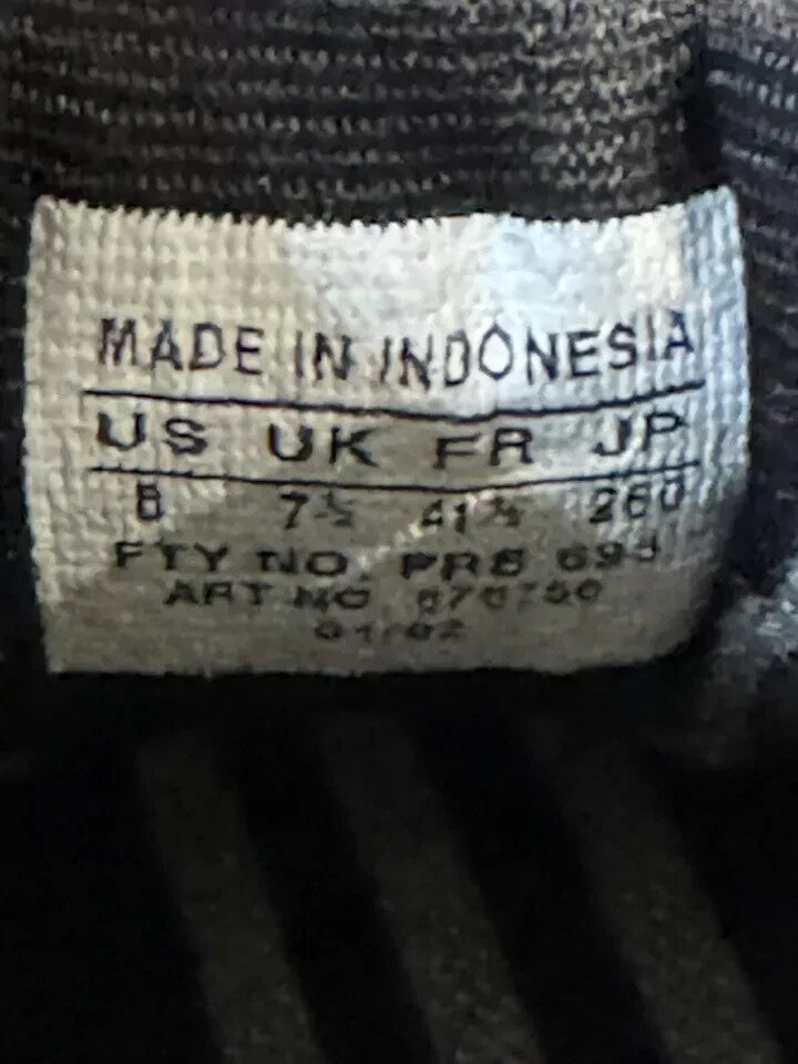 6973890